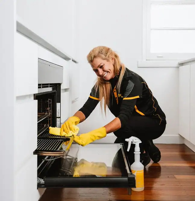 Maid2Match Field Staff cleaning the oven
