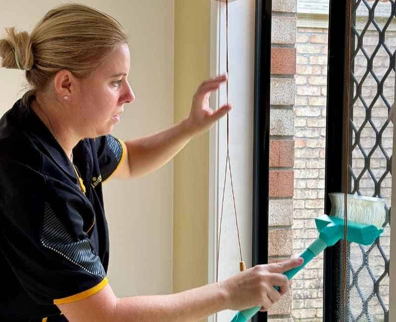 Maid2Match friendly and trusted house cleaner cleaning window screen